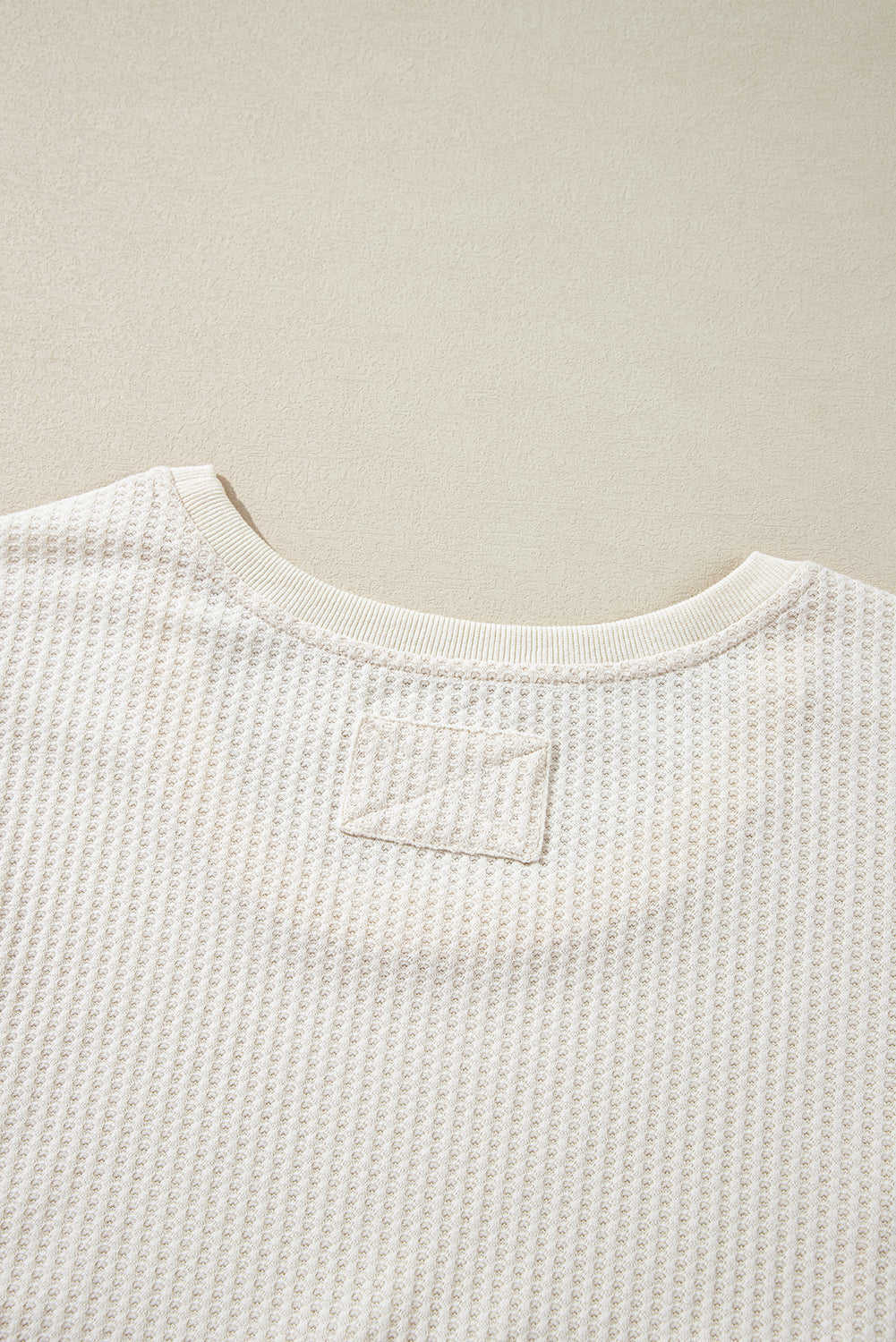 Haut oversize a col en V et coutures apparentes en tricot gaufré