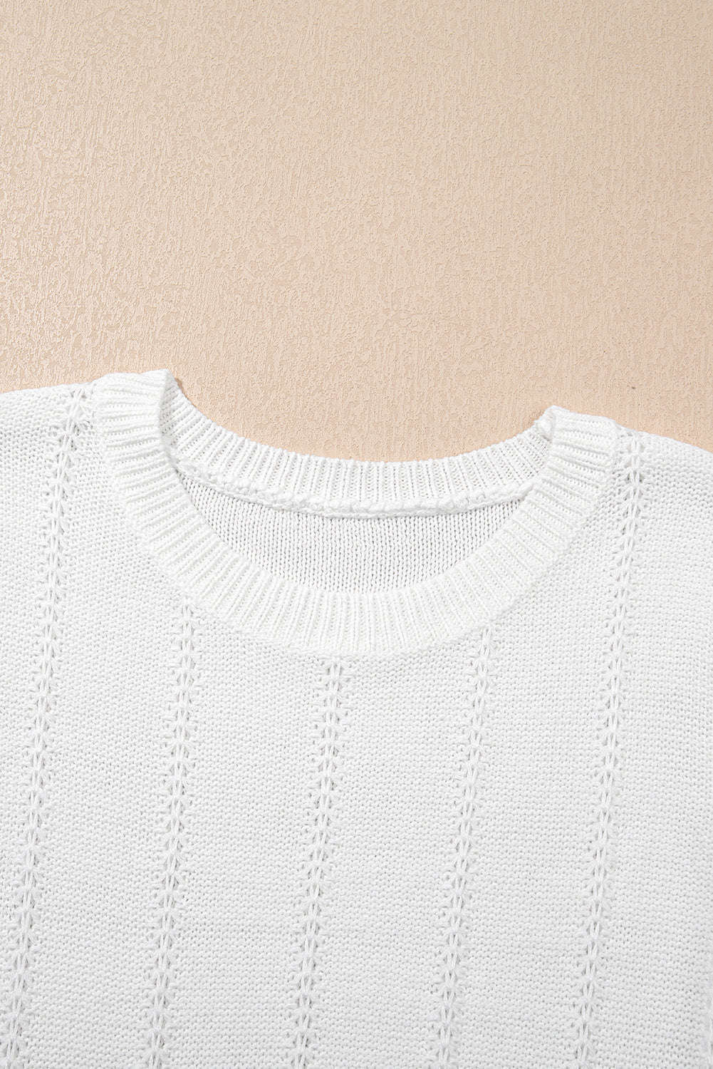 Pull ras du cou à manches courtes bouffantes en tricot pointelle