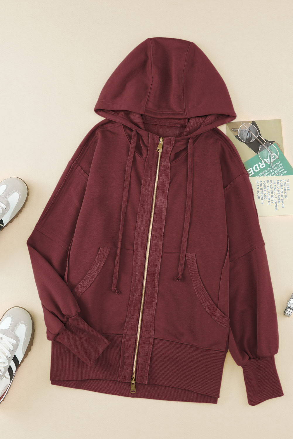 Sweat à capuche zippé à coutures exposées et bords bruts