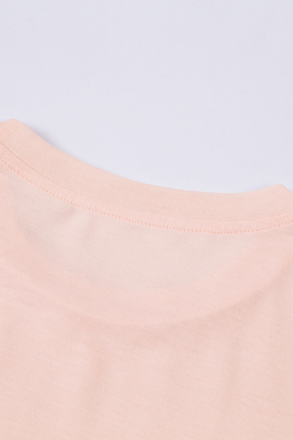 T-shirt rose à col rond de couleur unie