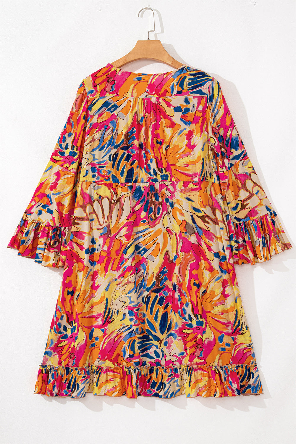 Robe tunique fluide à taille haute et manches évasées et ourlet à volants
