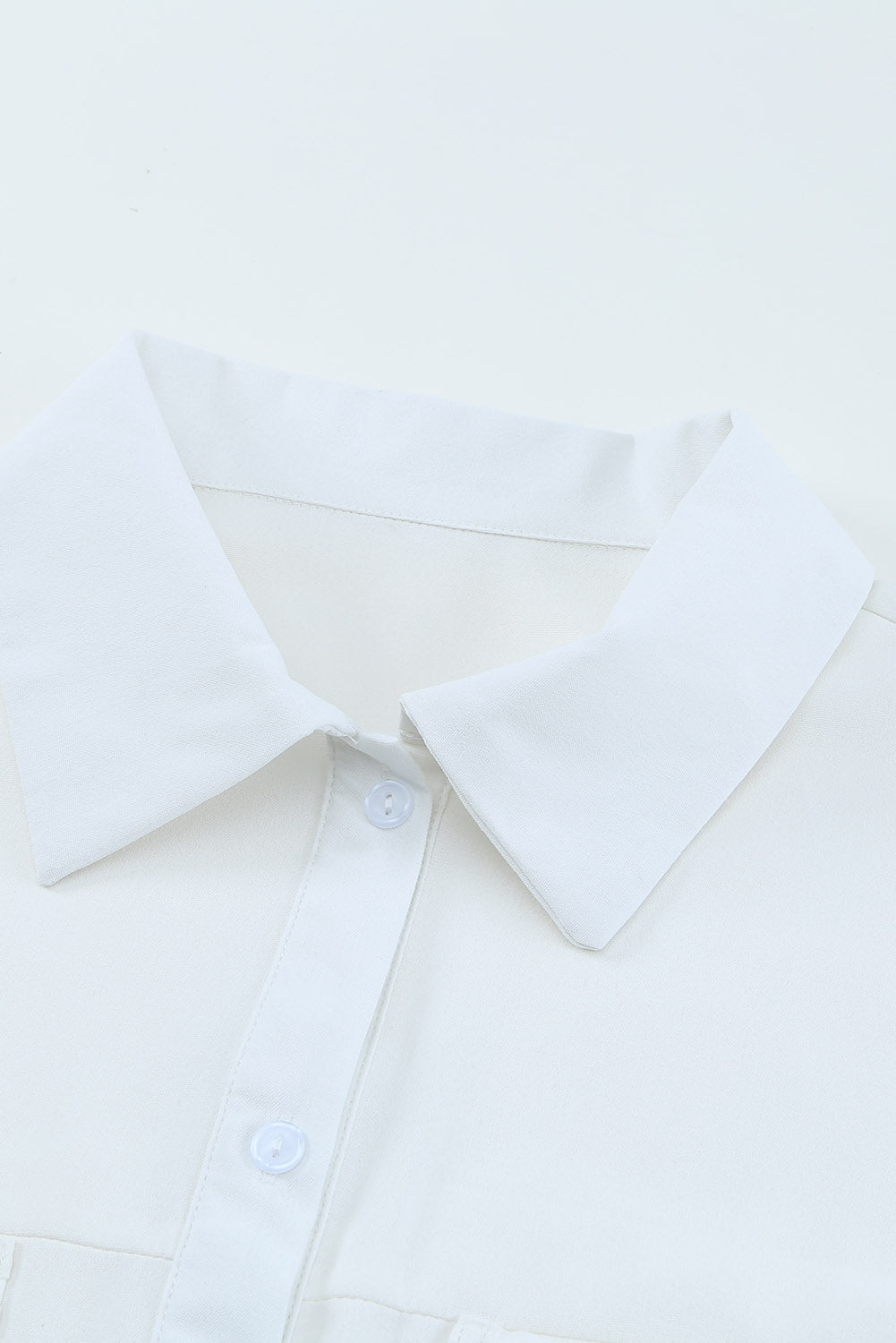 Chemise boutonnée à manches longues et poche unie