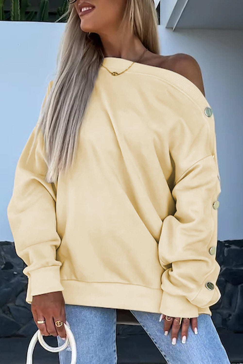 Sweat-shirt à manches boutonnées et épaules tombantes