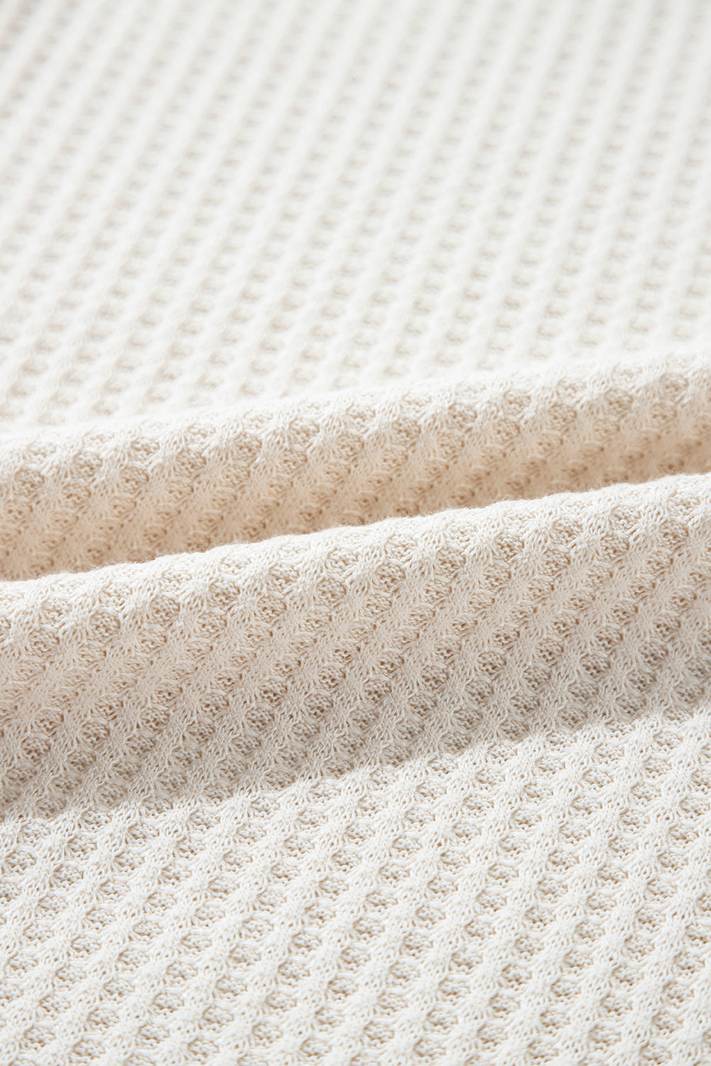 Haut oversize a col en V et coutures apparentes en tricot gaufré