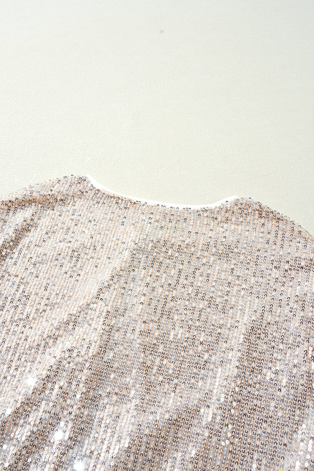 Veste zippée a paillettes et col rond a manches longues