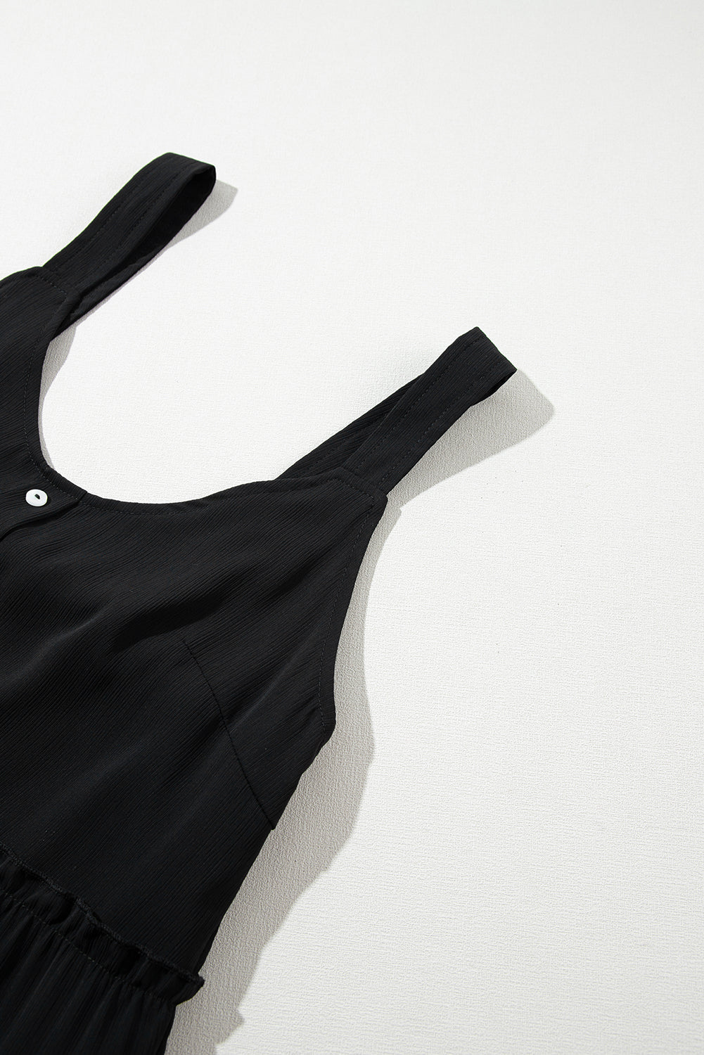 Robe sans manches à volants et col en V boutonné