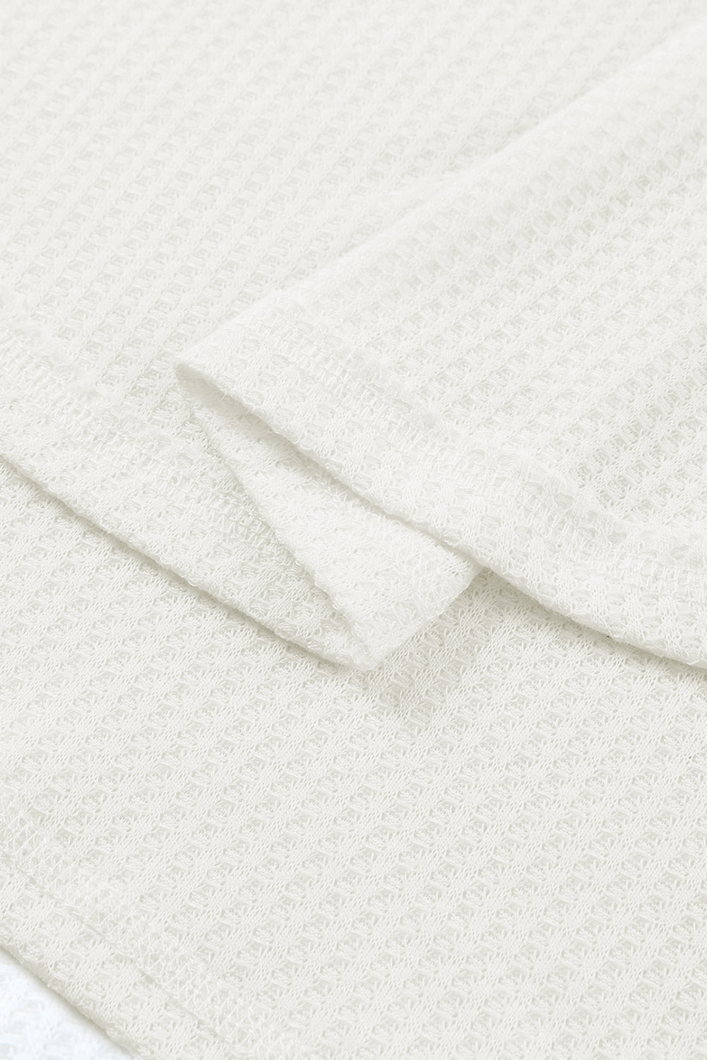 Haut ample en tricot gaufré blanc à épaules tombantes