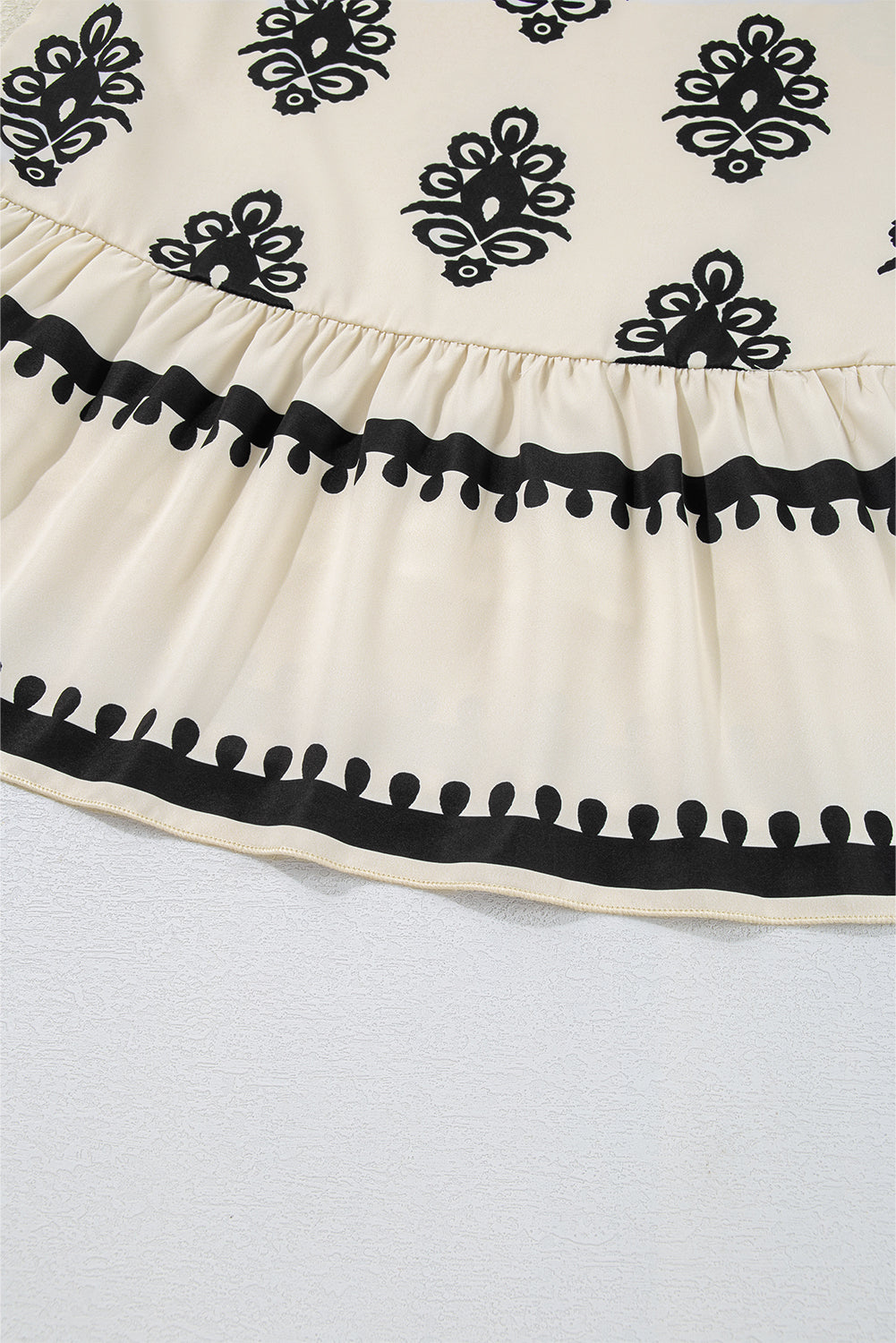 Mini-robe sans manches à imprimé géométrique avec nœud papillon dans le dos
