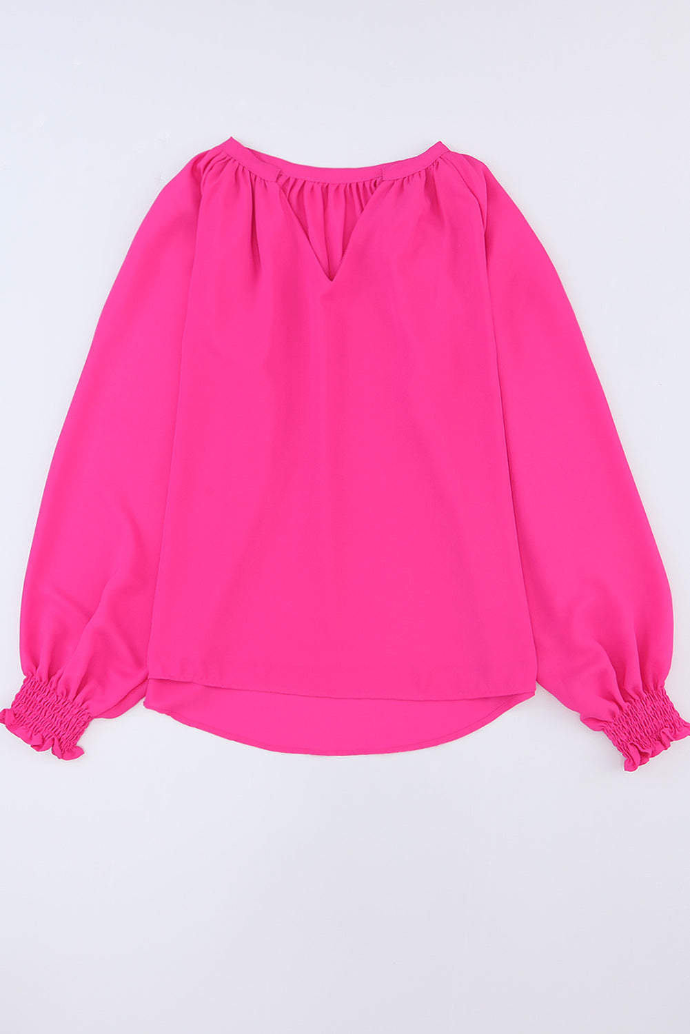 Blouse plissée à col en V et manches bouffantes