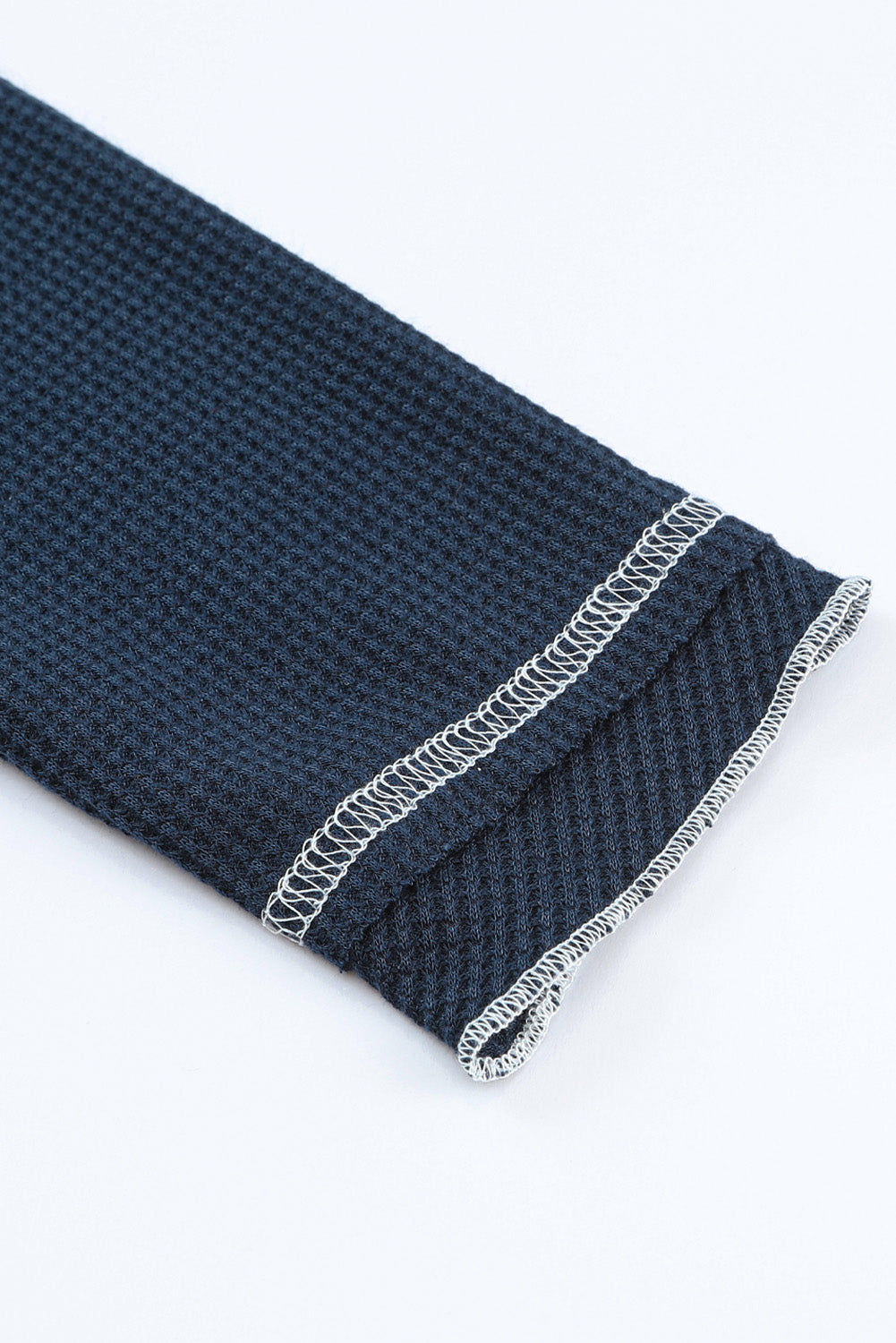 Haut texturé à manches longues et col rond