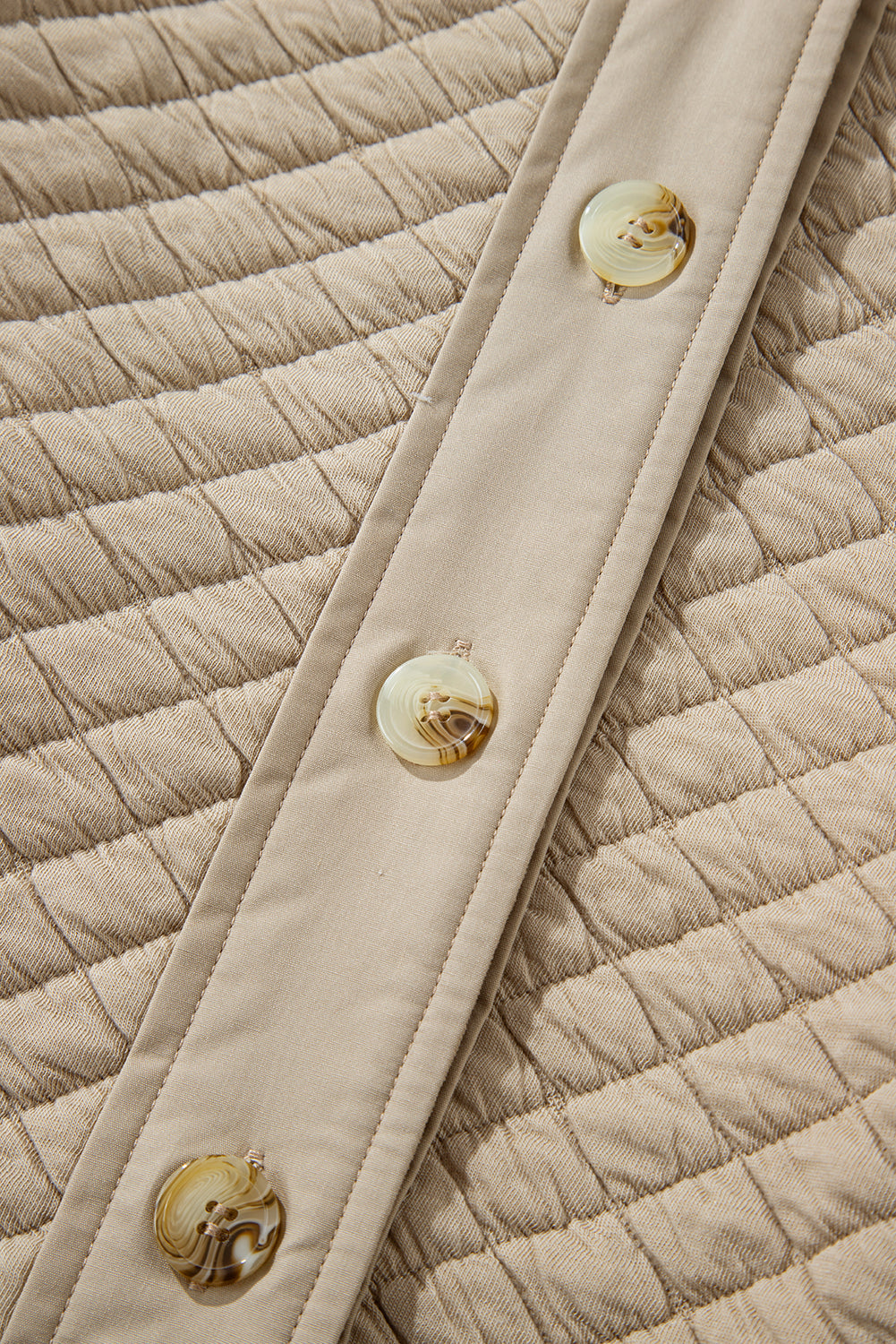 Veste matelassée boutonnée de couleur unie