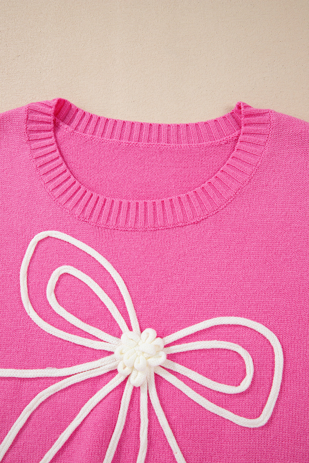 Pull décontracté à bordure côtelée et nœud fleuri