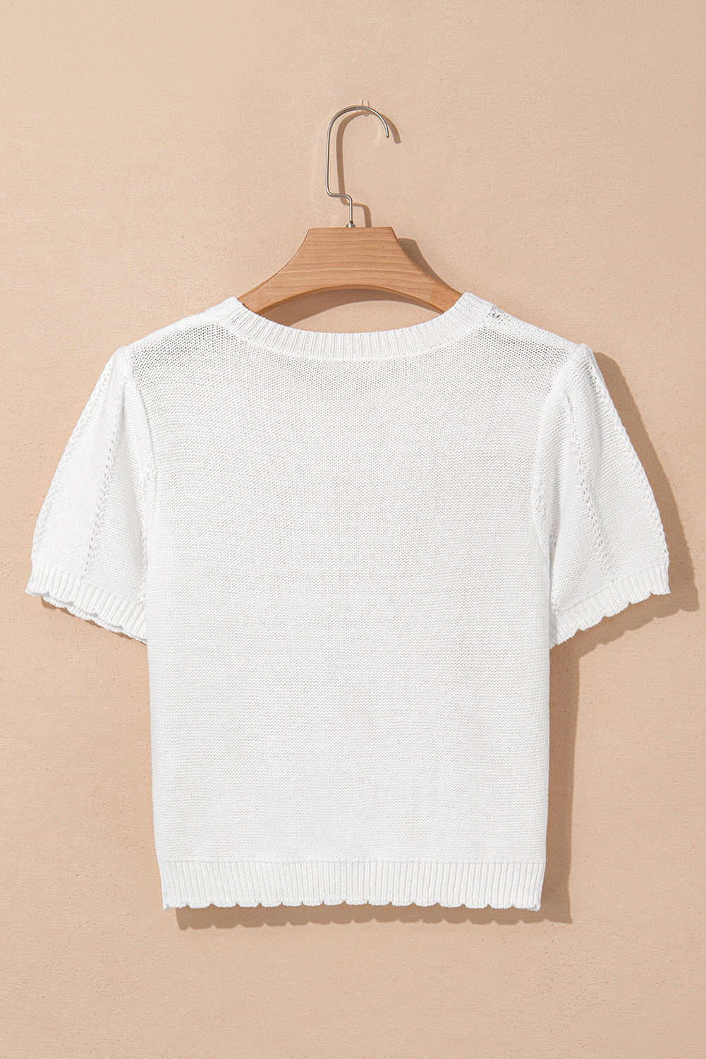 Pull ras du cou à manches courtes bouffantes en tricot pointelle