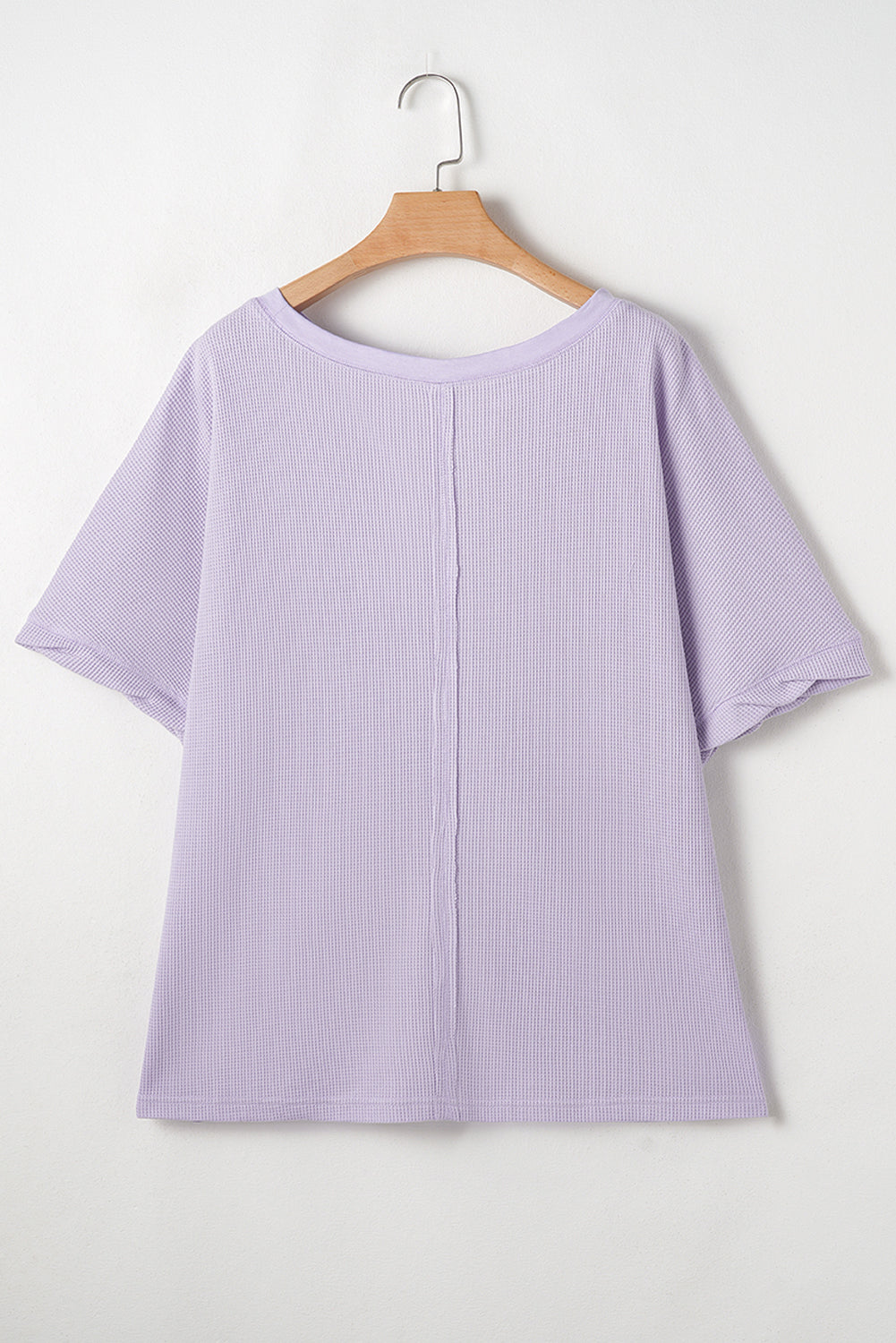 Haut grande taille en tricot gaufré à manches courtes et poches plaquées
