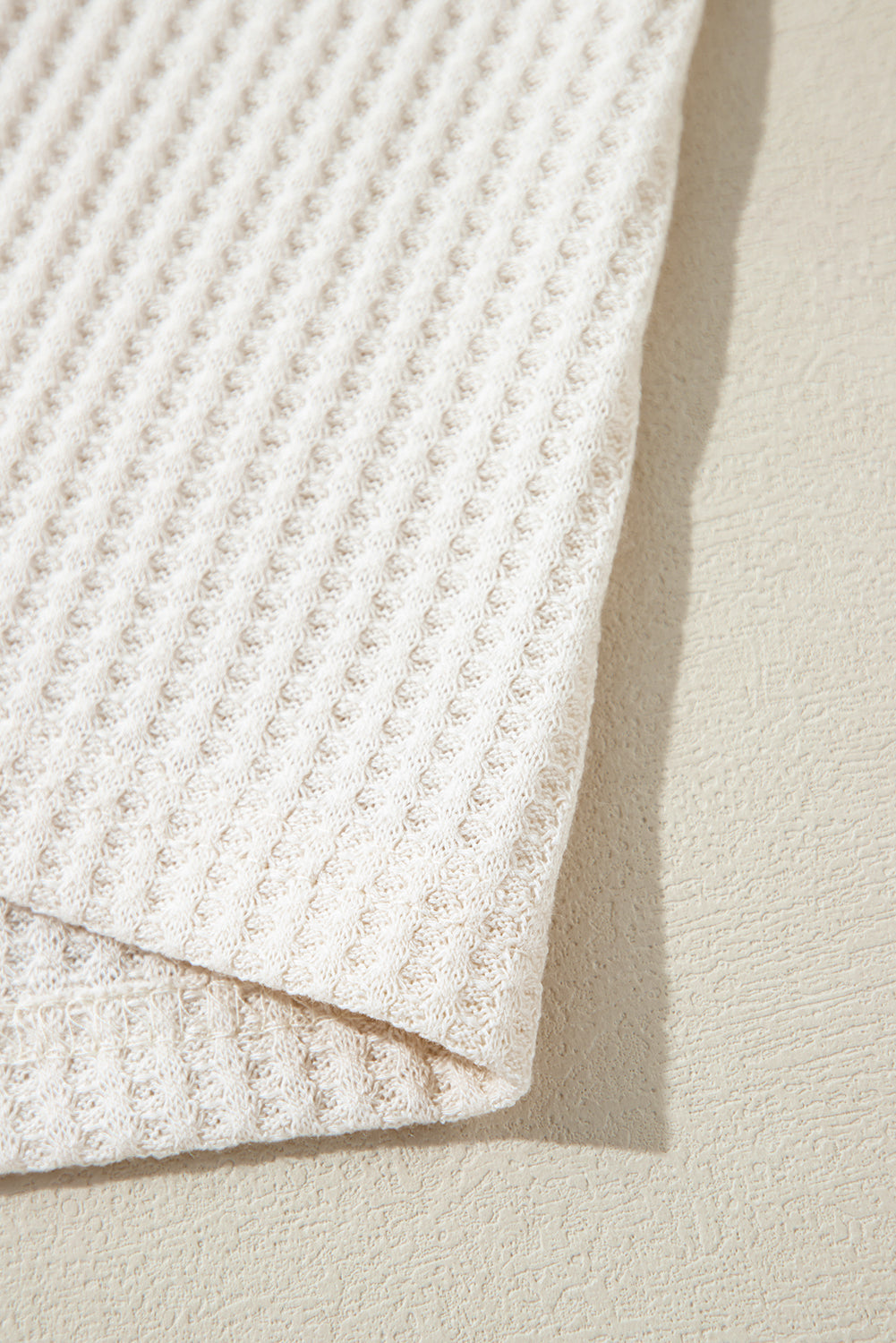 Haut oversize a col en V et coutures apparentes en tricot gaufré