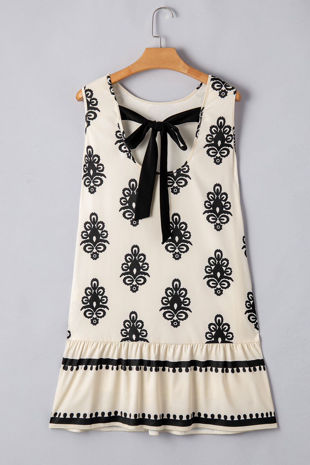 Mini-robe sans manches à imprimé géométrique avec nœud papillon dans le dos