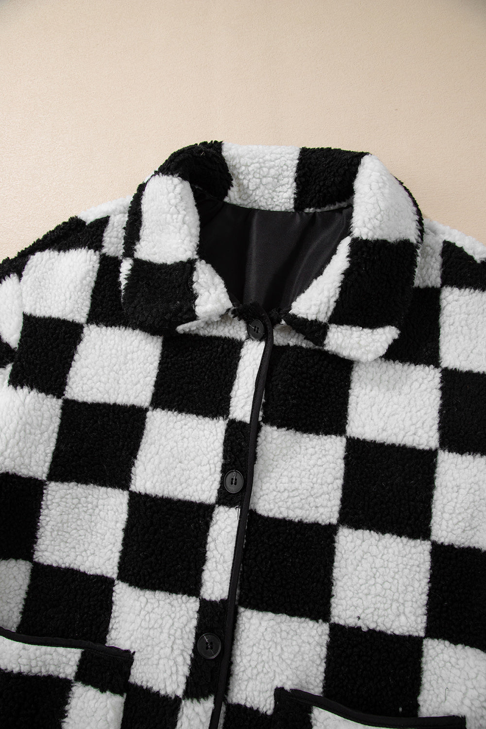 Veste polaire boutonnée a col et poches latérales a carreaux