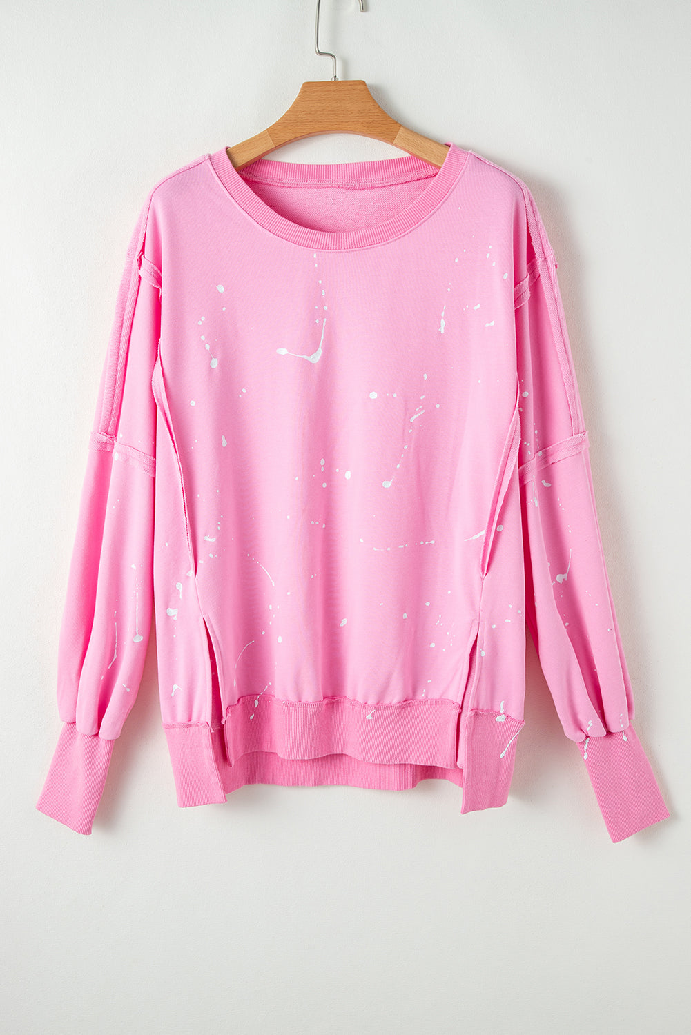 Sweat ample à coutures exposées et taches d'éclaboussures