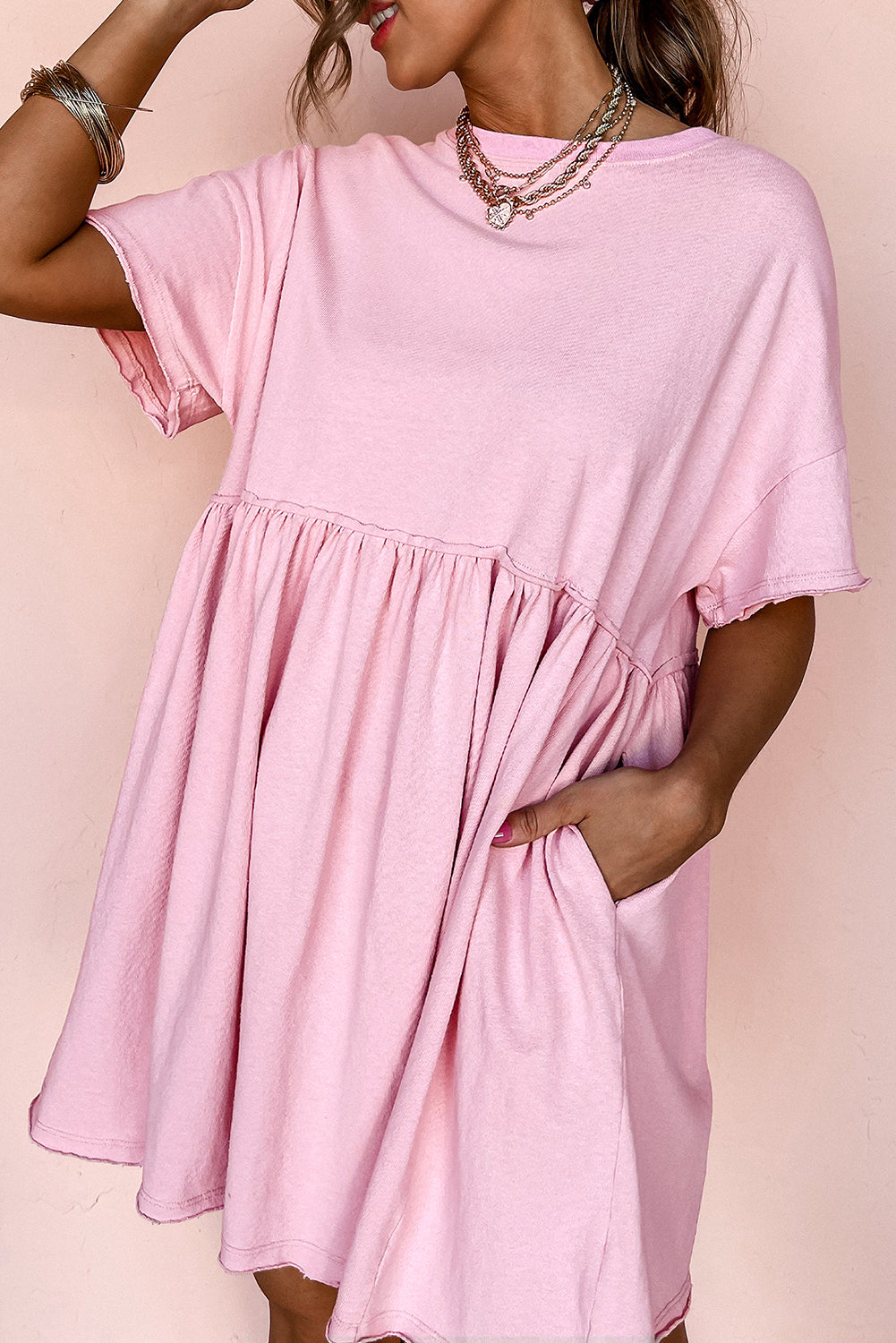 Robe babydoll unie à poches et bords bruts