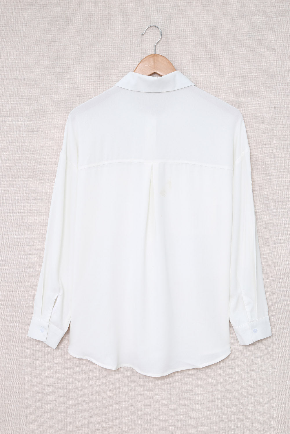 Chemise boutonnée à manches longues et poche unie