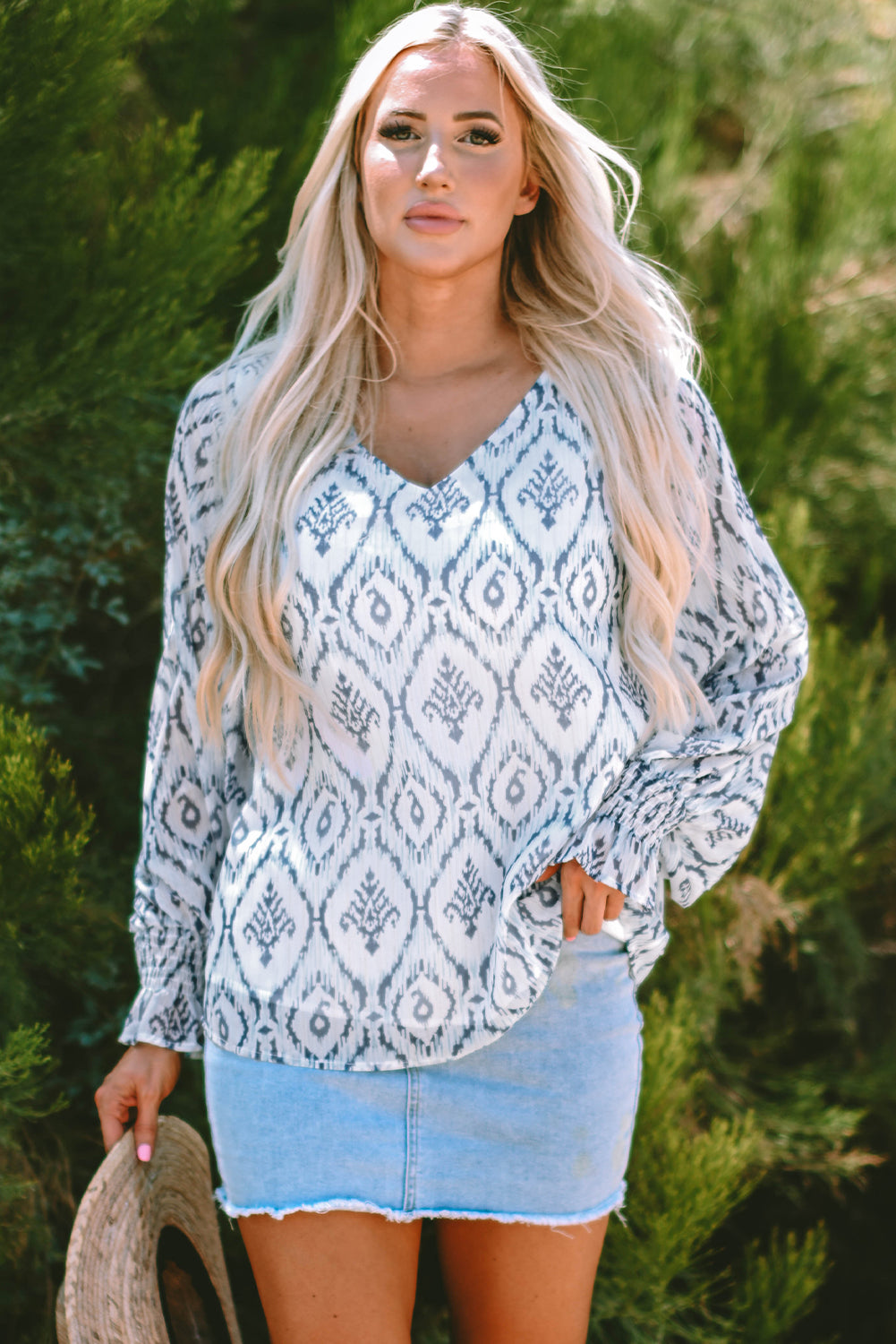 Blouse froncée a manches bouffantes et imprimé géométrique