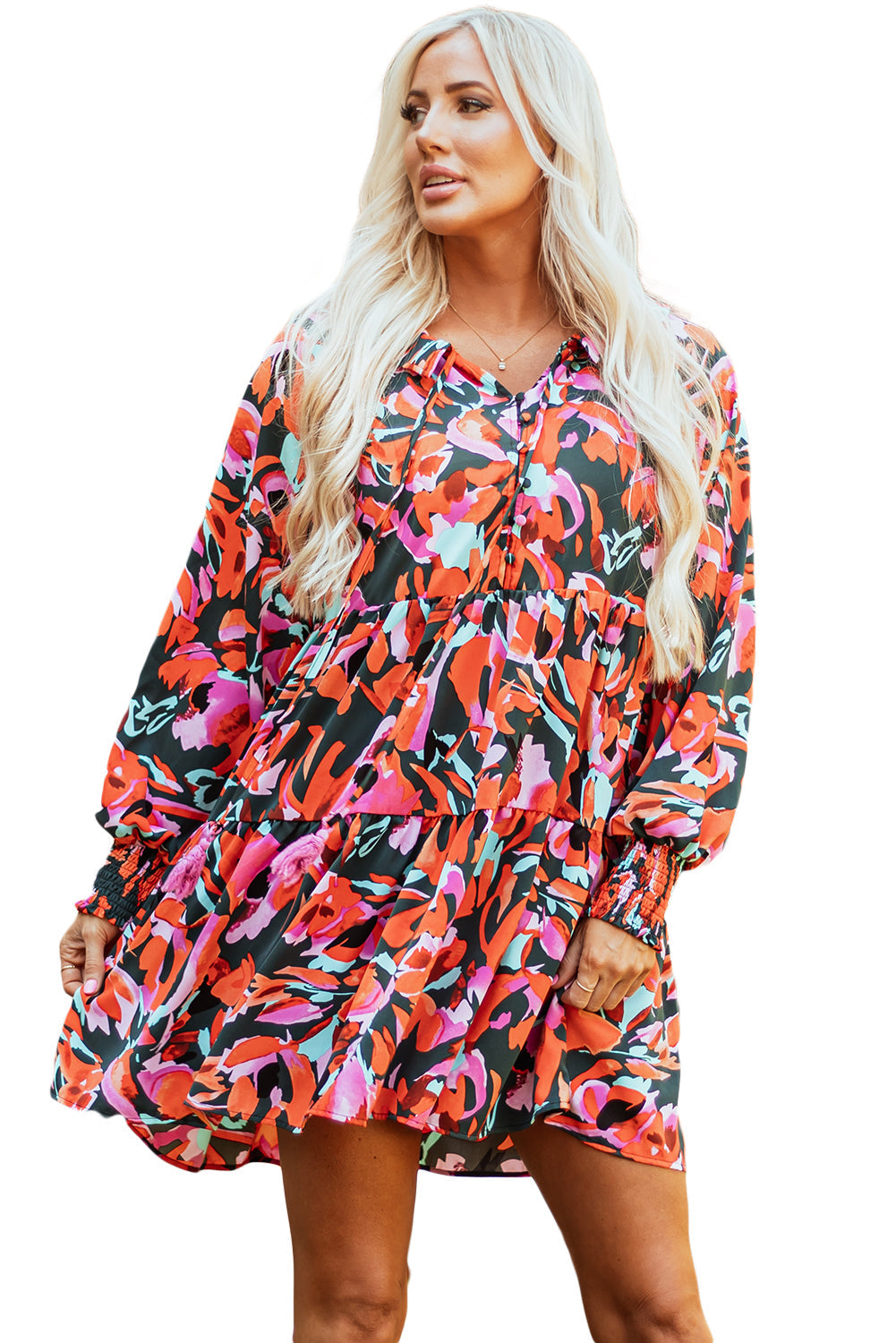 Mini-robe florale smockée a manches évêque et pompon