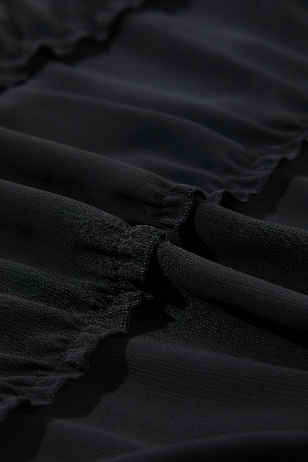 Robe sans manches à volants et col en V boutonné