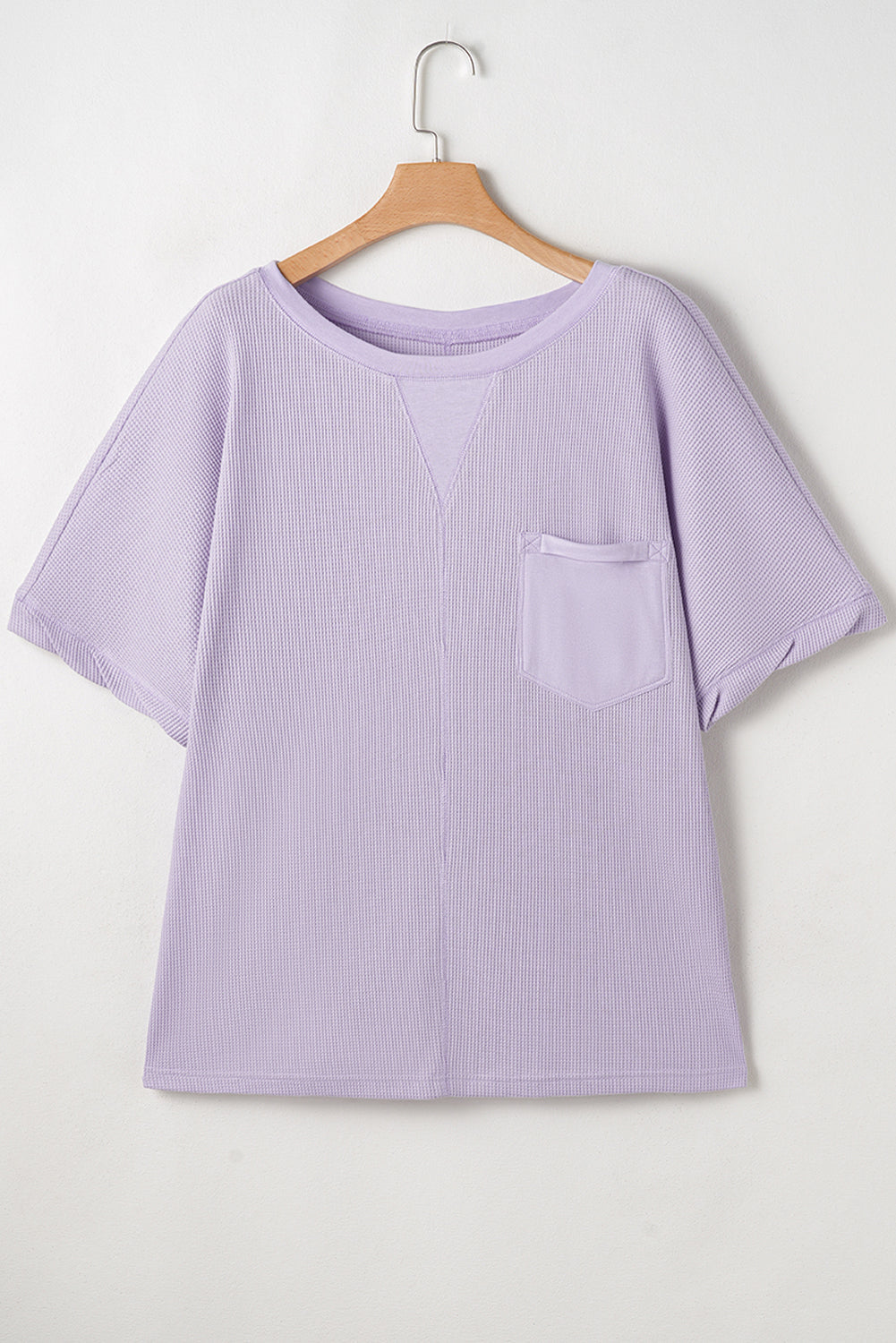 Haut grande taille en tricot gaufré à manches courtes et poches plaquées