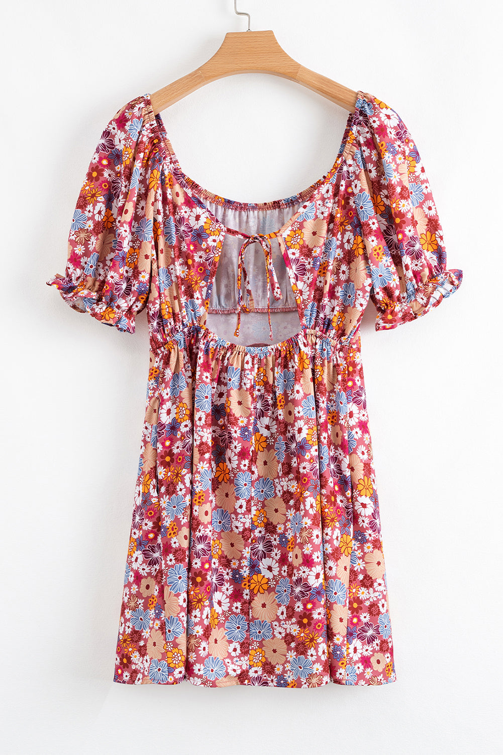 Mini-robe fleurie à manches bouffantes, col carré, nœud et dos ouvert