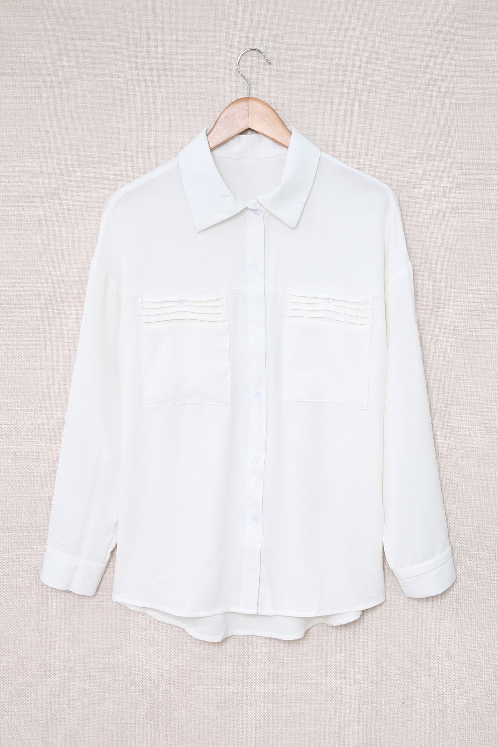 Chemise boutonnée à manches longues et poche unie