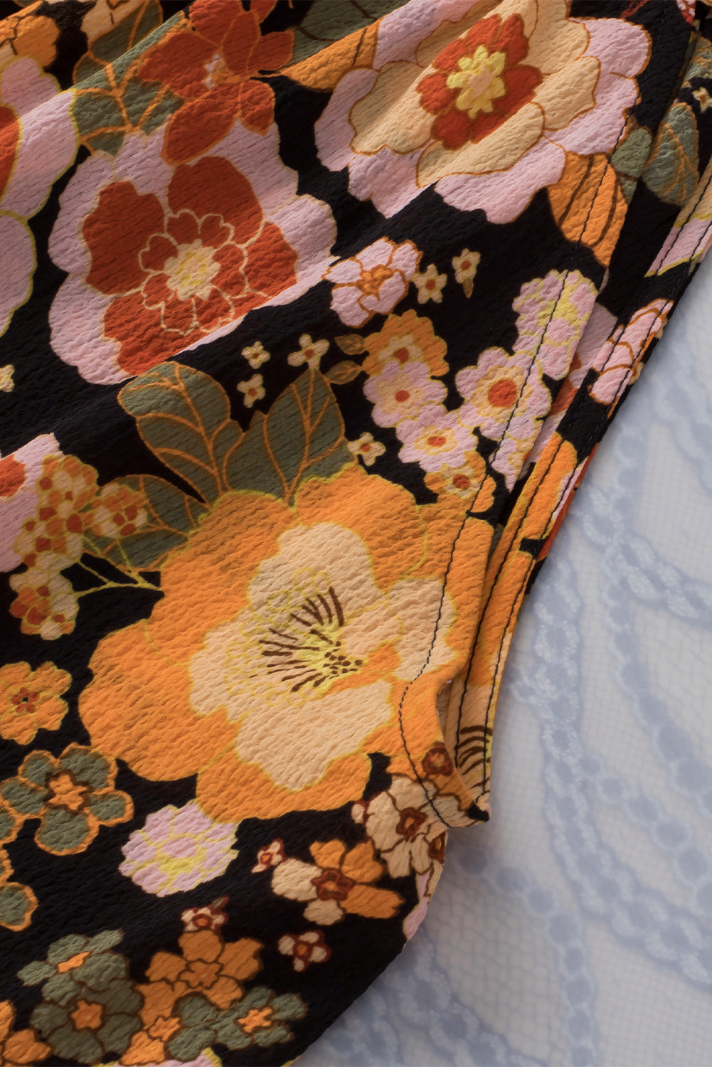 Haut sans manches noué à imprimé floral et col licou