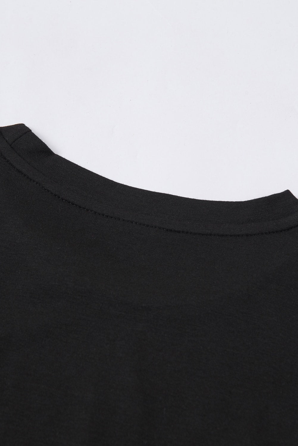 T-shirt noir à col rond de couleur unie