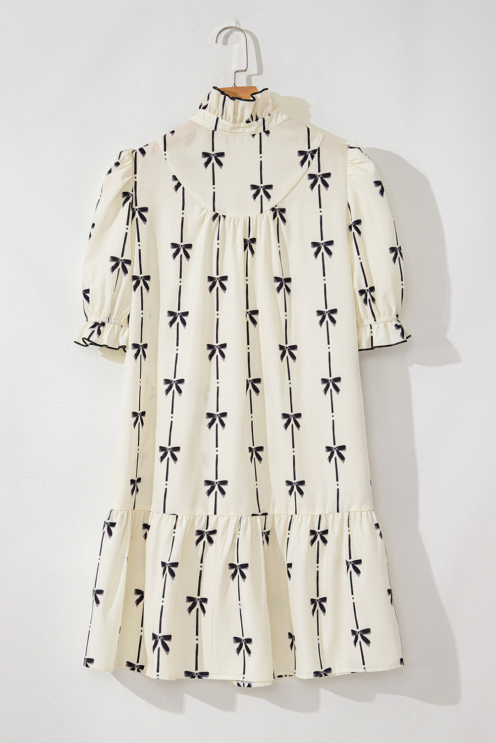 Mini-robe mignonne a col en V et manches bulles imprimées avec nœud papillon