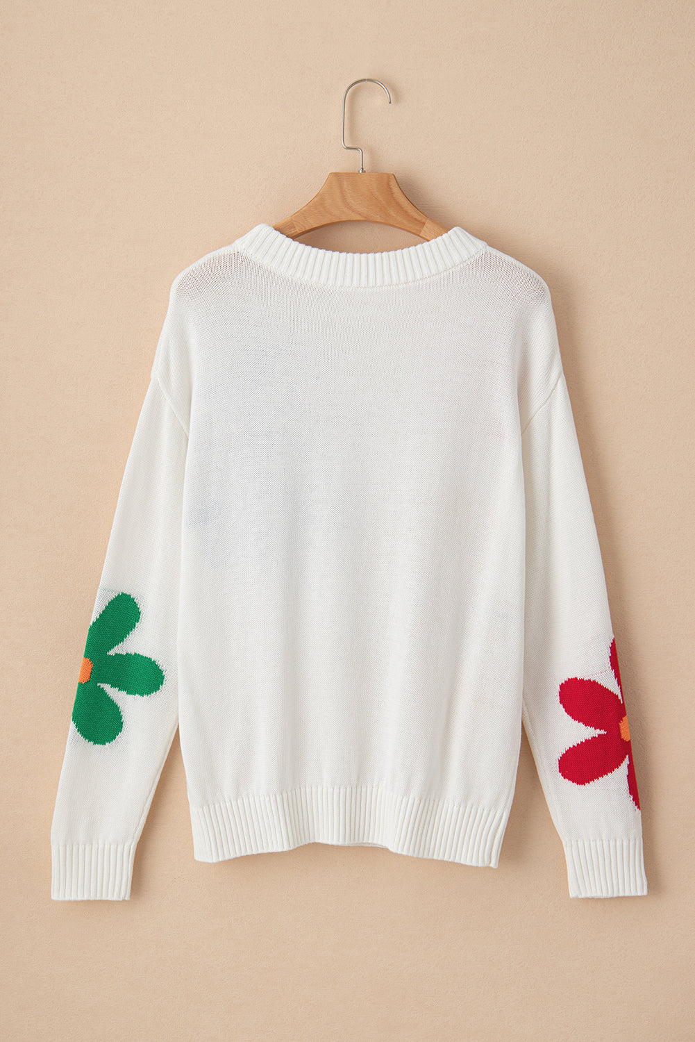 Pull a col rond a motif de grandes fleurs colorées
