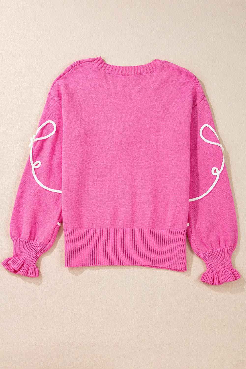 Pull décontracté à bordure côtelée et nœud fleuri