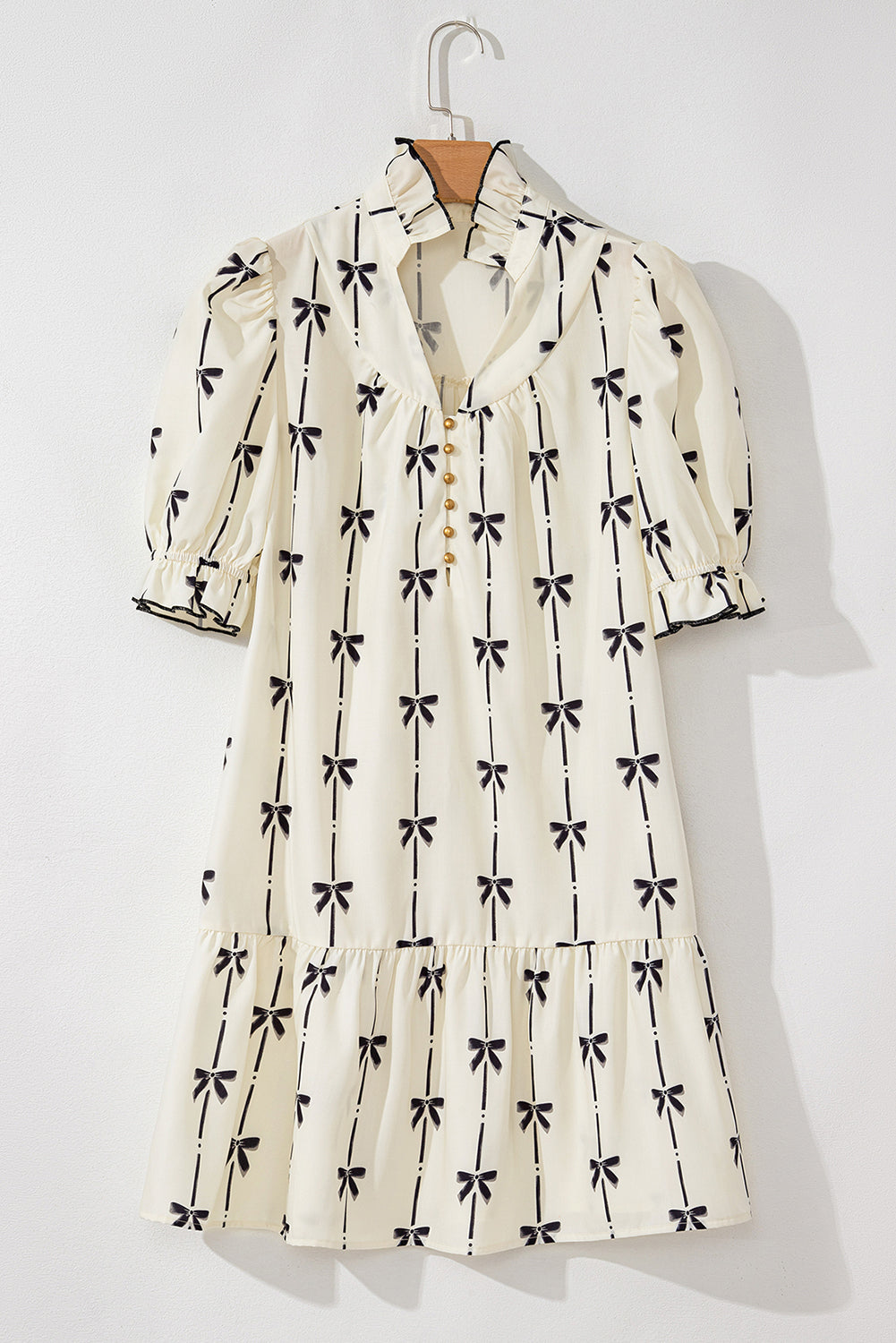 Mini-robe mignonne a col en V et manches bulles imprimées avec nœud papillon