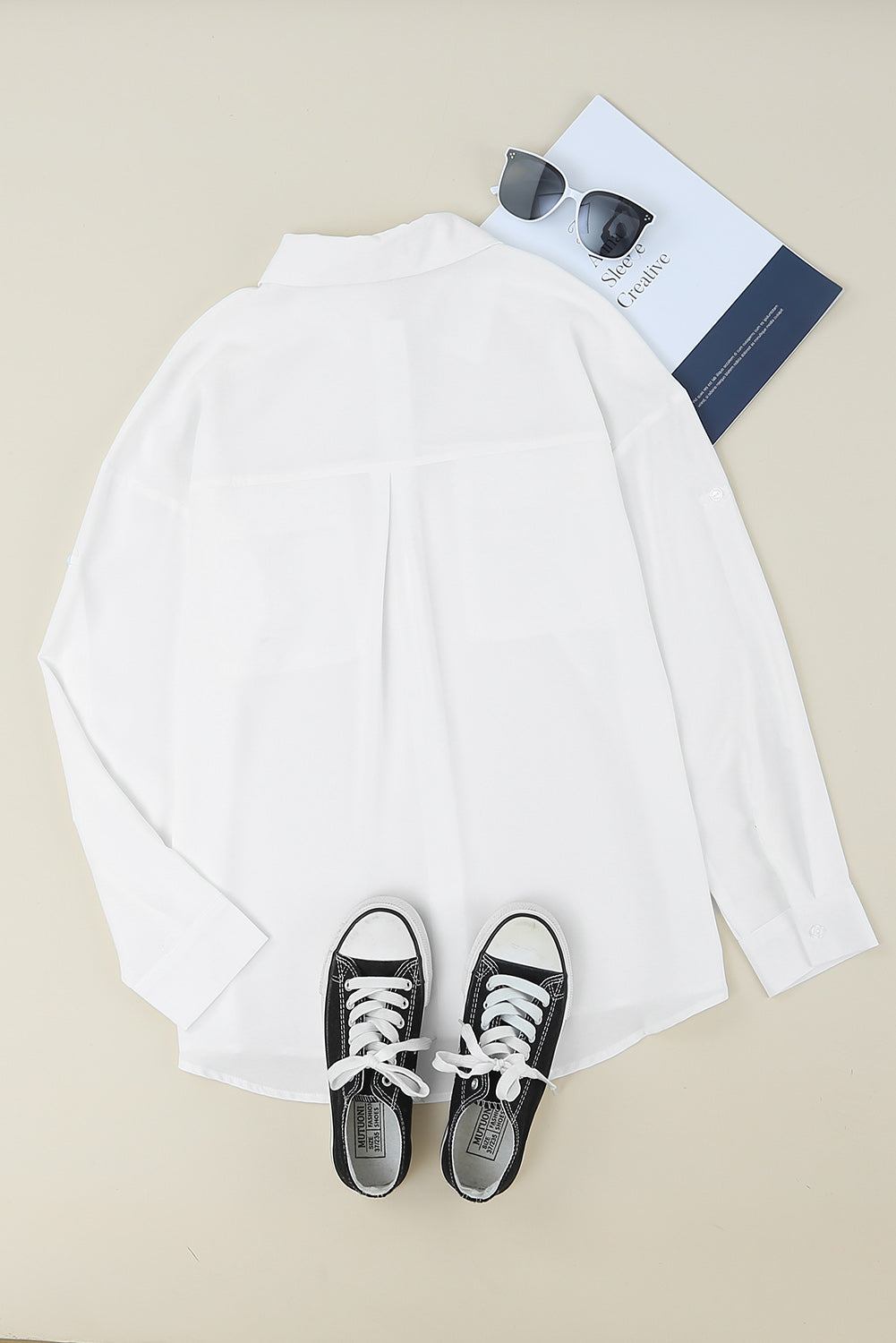 Chemise boutonnée à manches longues et poche unie