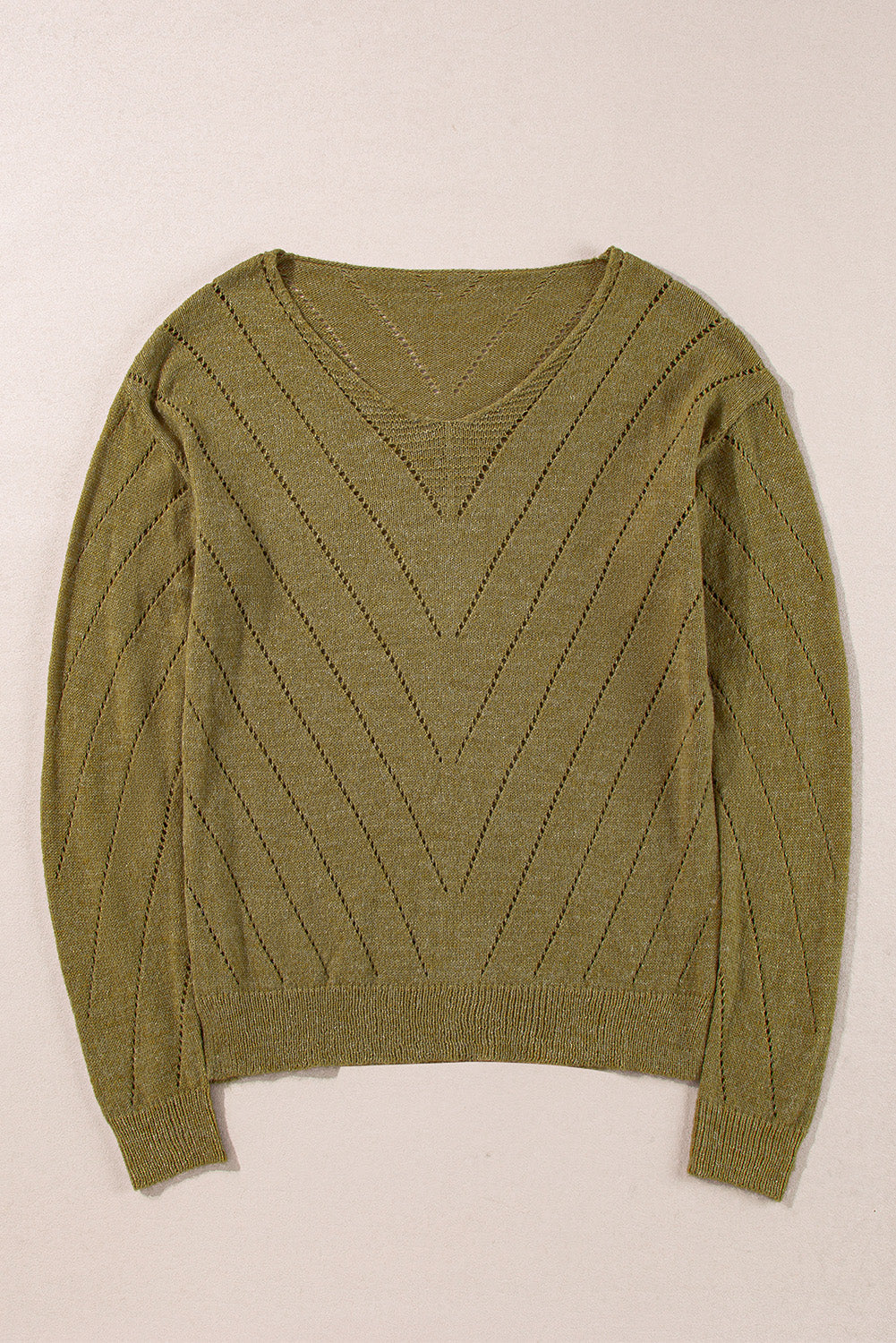 Pull uni à col en V et épaules tombantes avec œillets