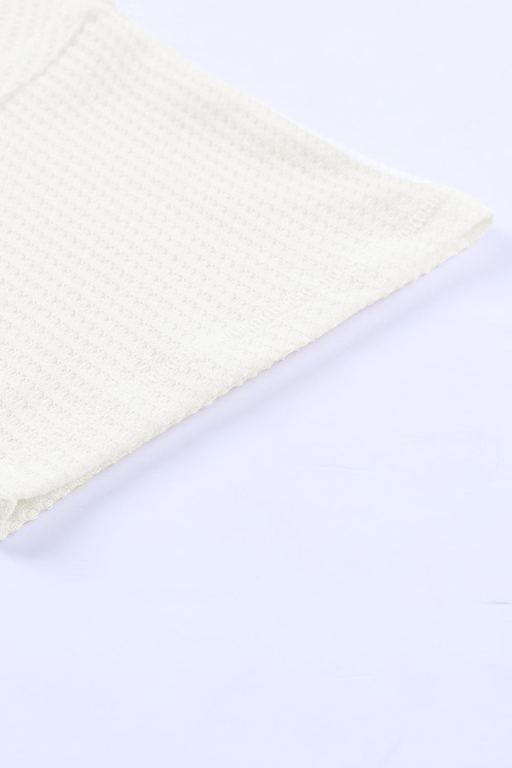 Haut ample en tricot gaufré blanc à épaules tombantes