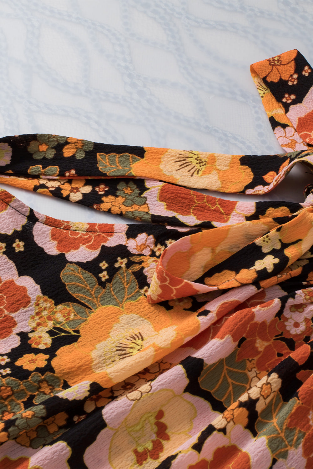 Haut sans manches noué à imprimé floral et col licou