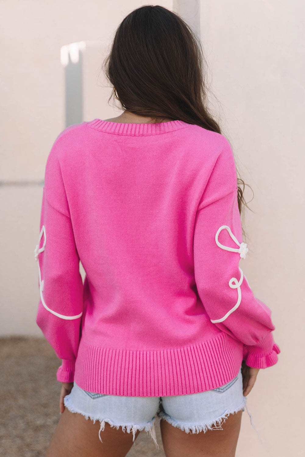 Pull décontracté à bordure côtelée et nœud fleuri