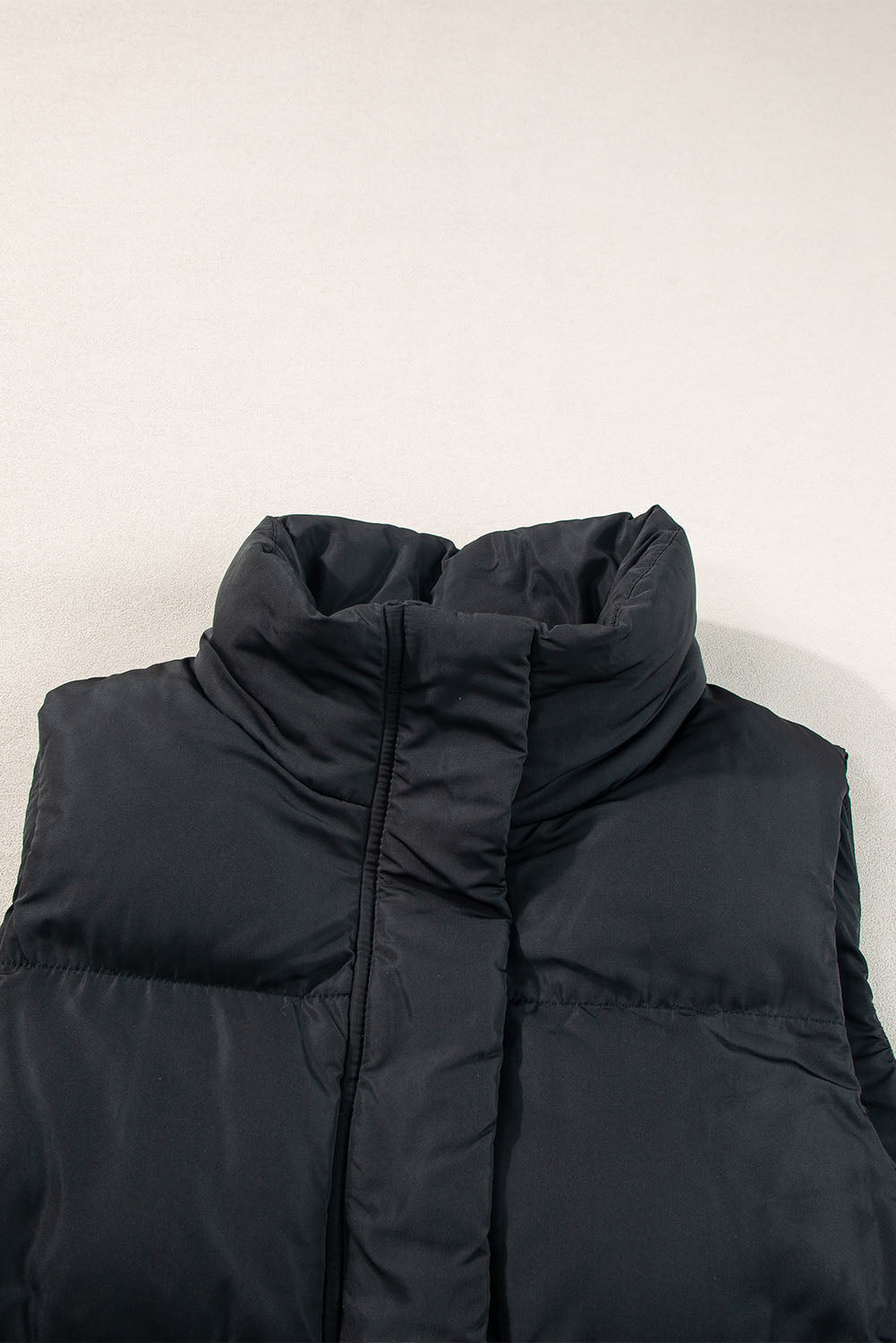 Gilet long coupe-vent a fermeture éclair et poches