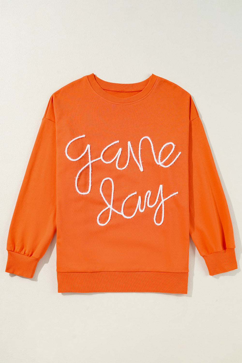 Tinsel Game Day - Sweat-shirt graphique a épaules tombantes