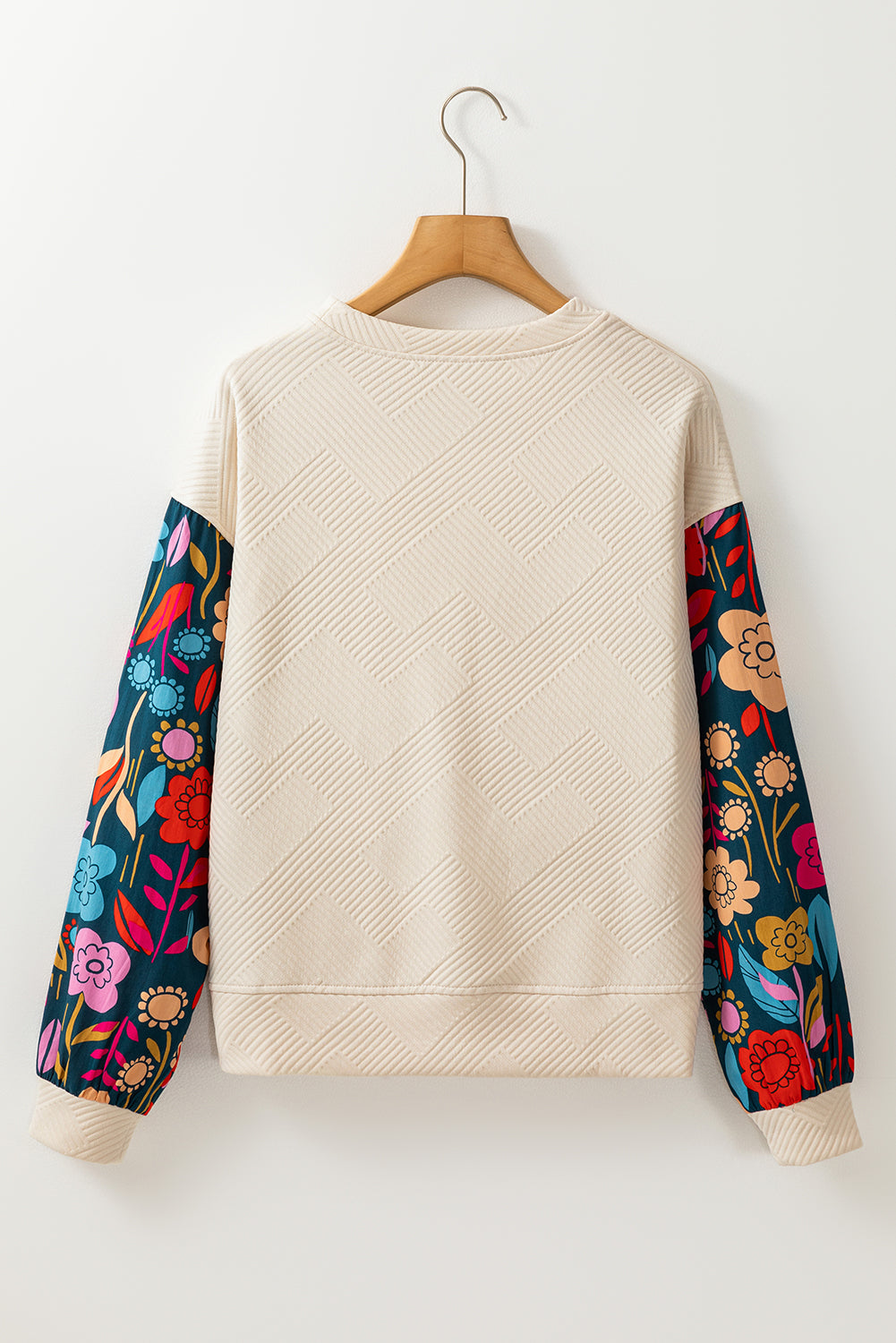 Haut en tricot texturé a épaules tombantes et manches florales contrastées