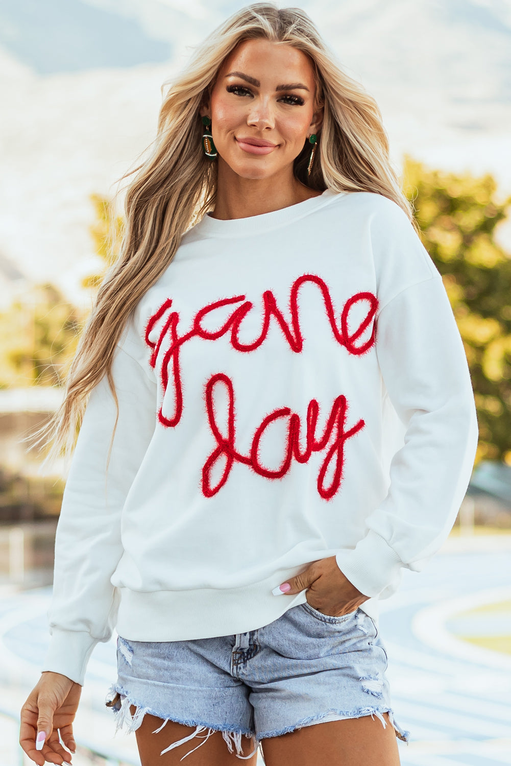 Tinsel Game Day - Sweat-shirt graphique à épaules tombantes