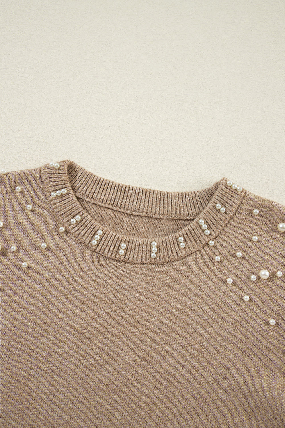 Pull à col rond et épaules tombantes perlées