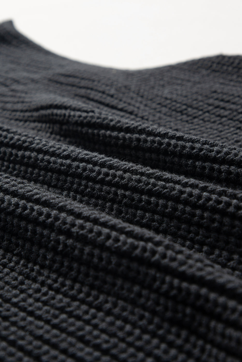 Gilet pull a col haut en tricot torsadé de couleur unie