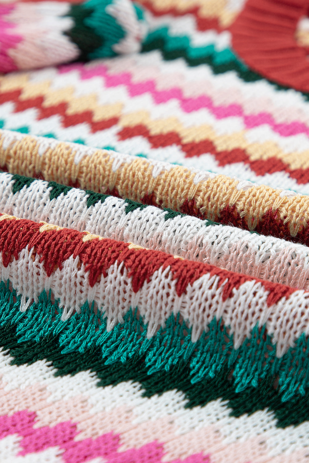 Pull texturé coloré a manches volantées et bordures