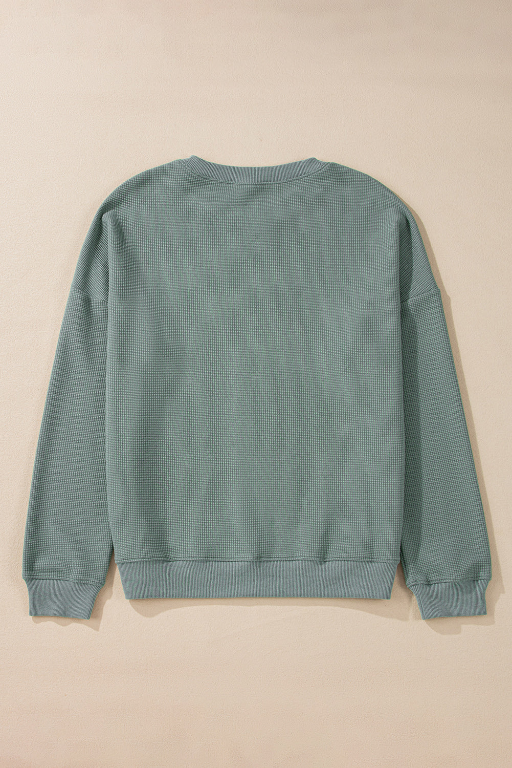 Haut en tricot gaufré a épaules tombantes et col en V