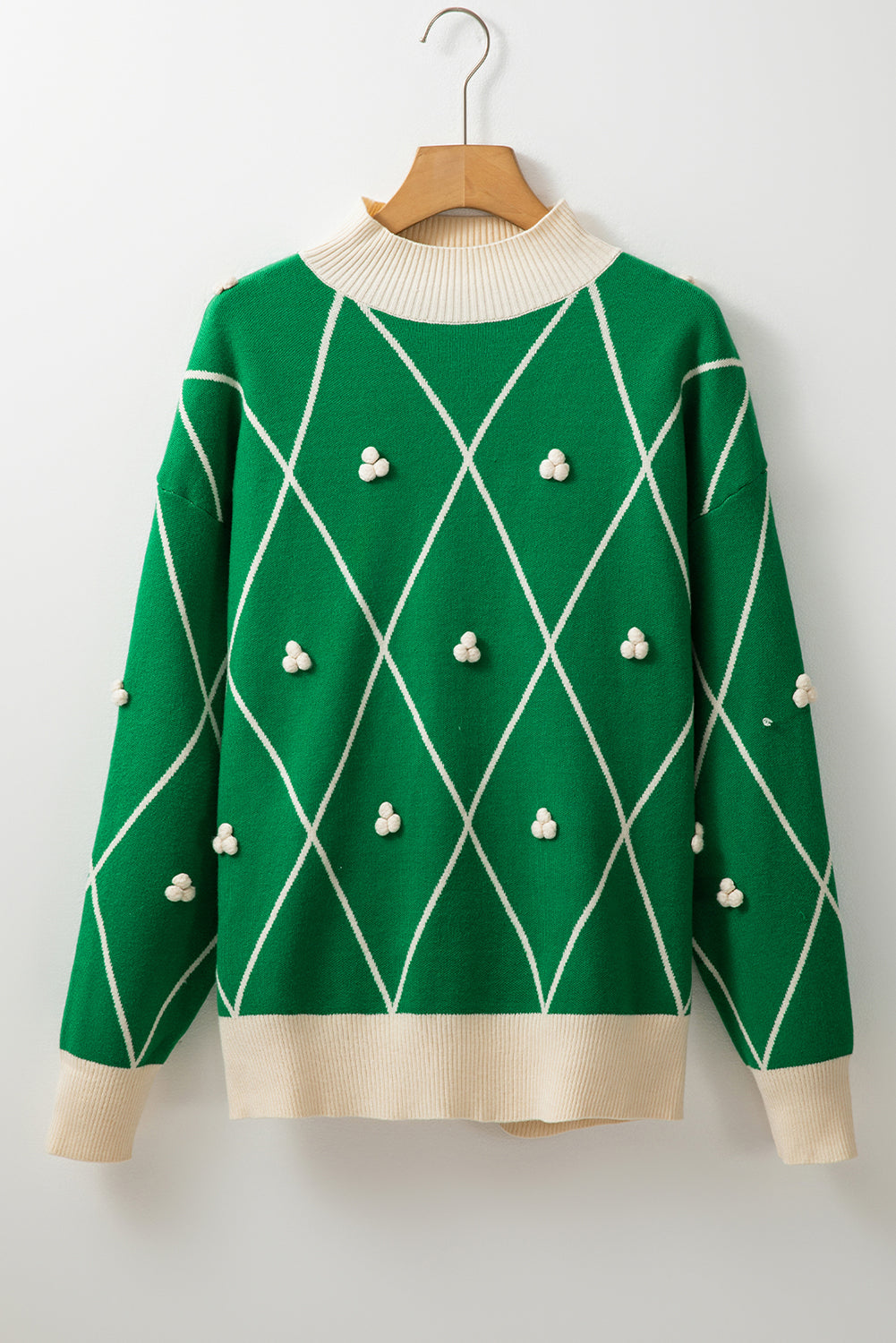 Pull a col haut avec bordure contrastée et accents de pompons a motif diamant